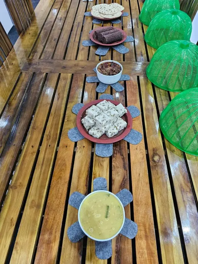 Breakfast table laid with traditional Sri Lankan dishes