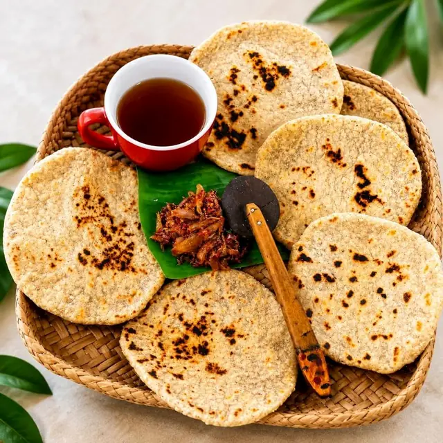 Basket of pol roti with tea and lunu miris